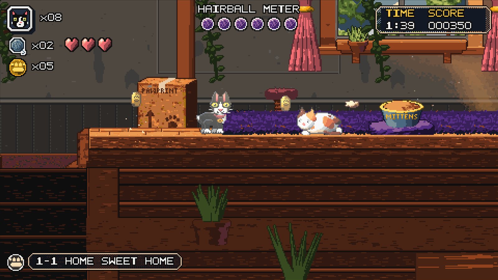 Mittens near the end of the first level, beside a food bowl and a sleeping cat.
